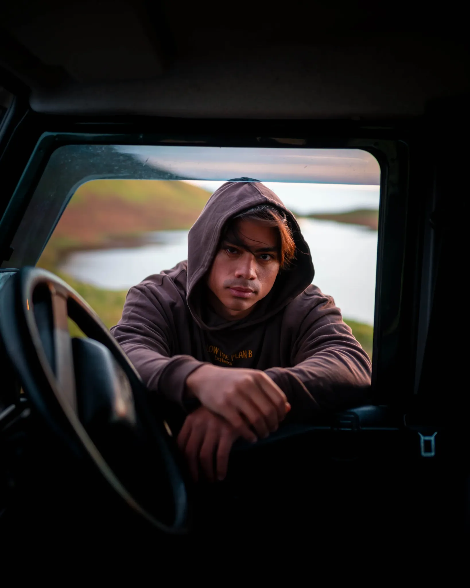 Eric Sierra leaning from a car window on location