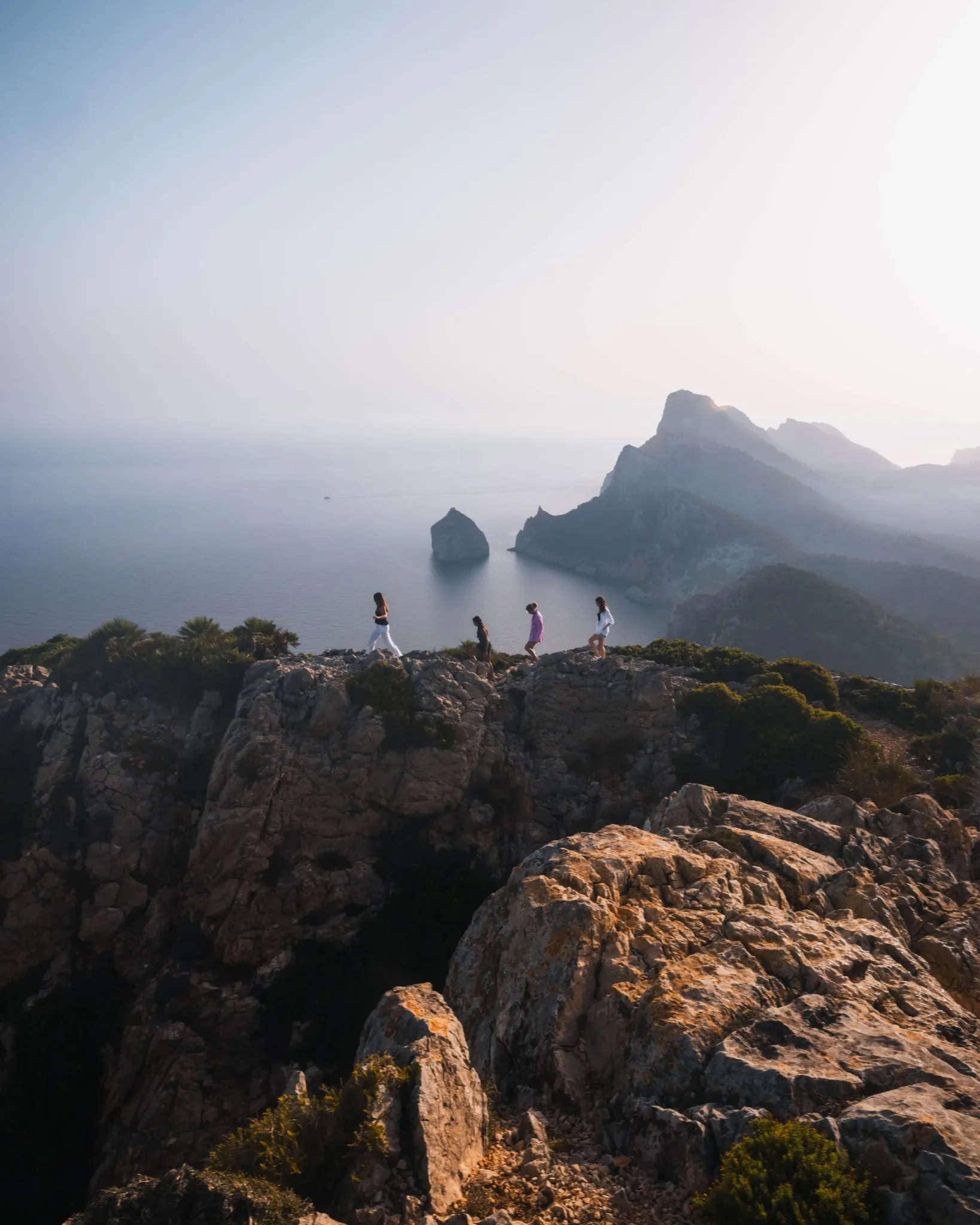 Creator hiking above a mountain lake